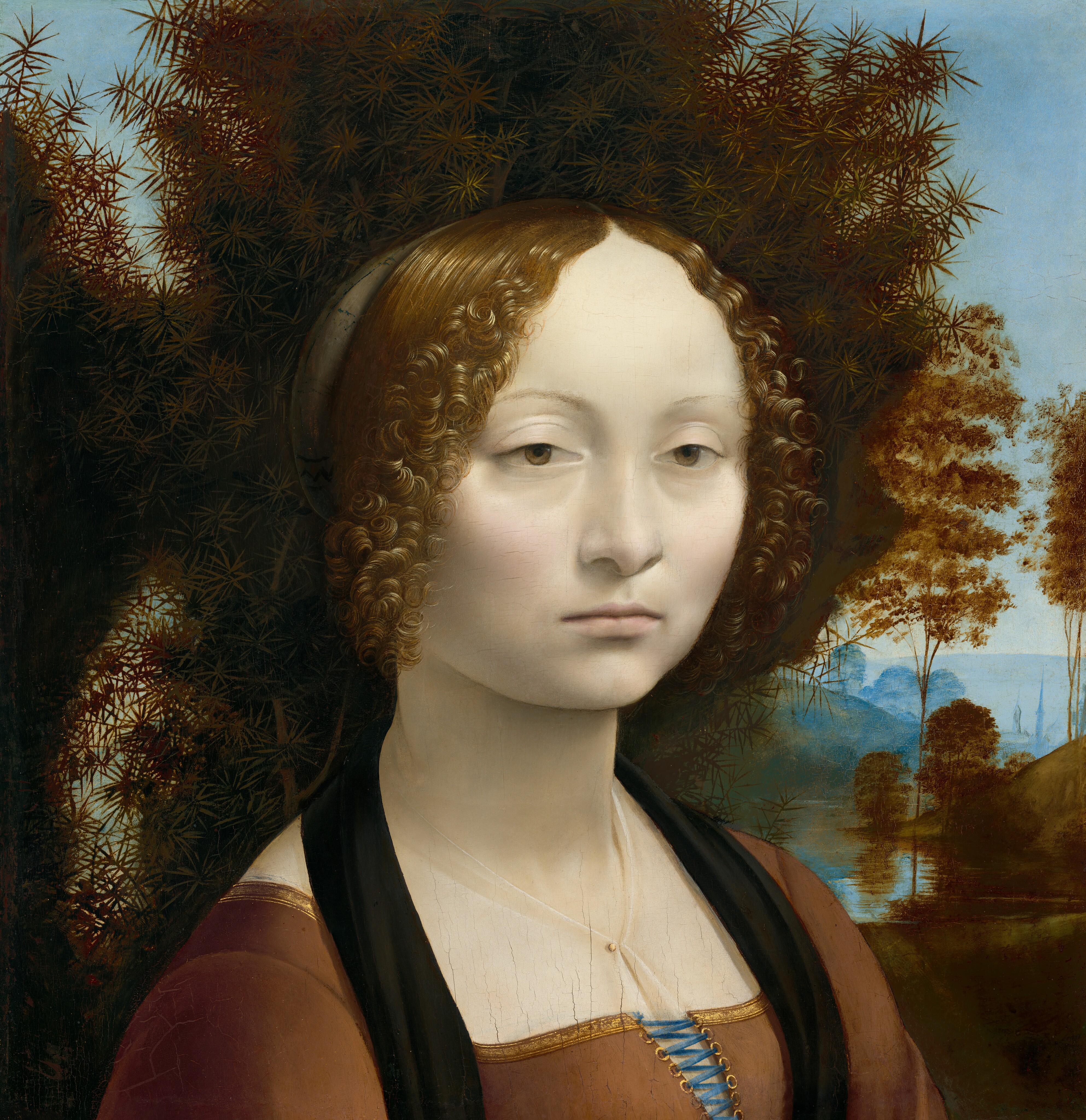 Leonardo da Vinci’s portrait of Ginevra de’ Benci facing slightly toward the viewer before dark juniper leaves and a distant landscape.