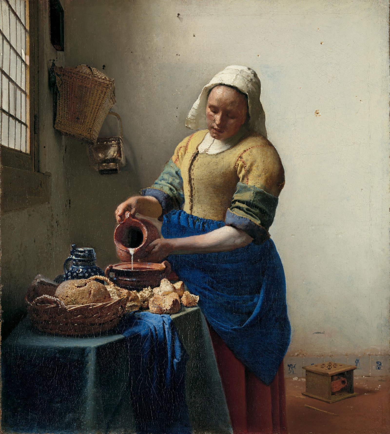 Vermeer’s The Milkmaid, showing a woman pouring milk beside bread and pottery in a sunlit room.