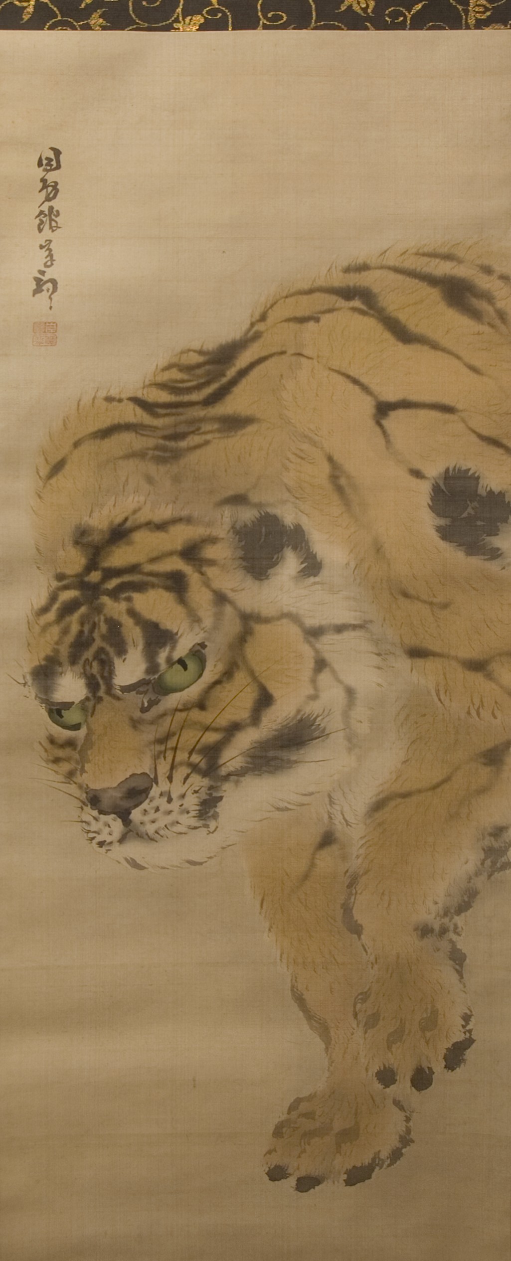 Gan Ku’s tall Japanese hanging scroll with a striped tiger curving through the picture and turning its alert face toward the viewer.